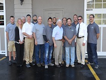 group of staff posing outside