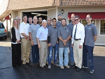 group of staff posing outside